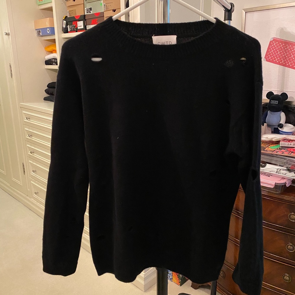 Cashmere sweater with holes